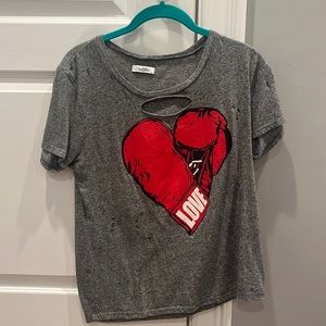 Grey t shirt with holes and red heart
